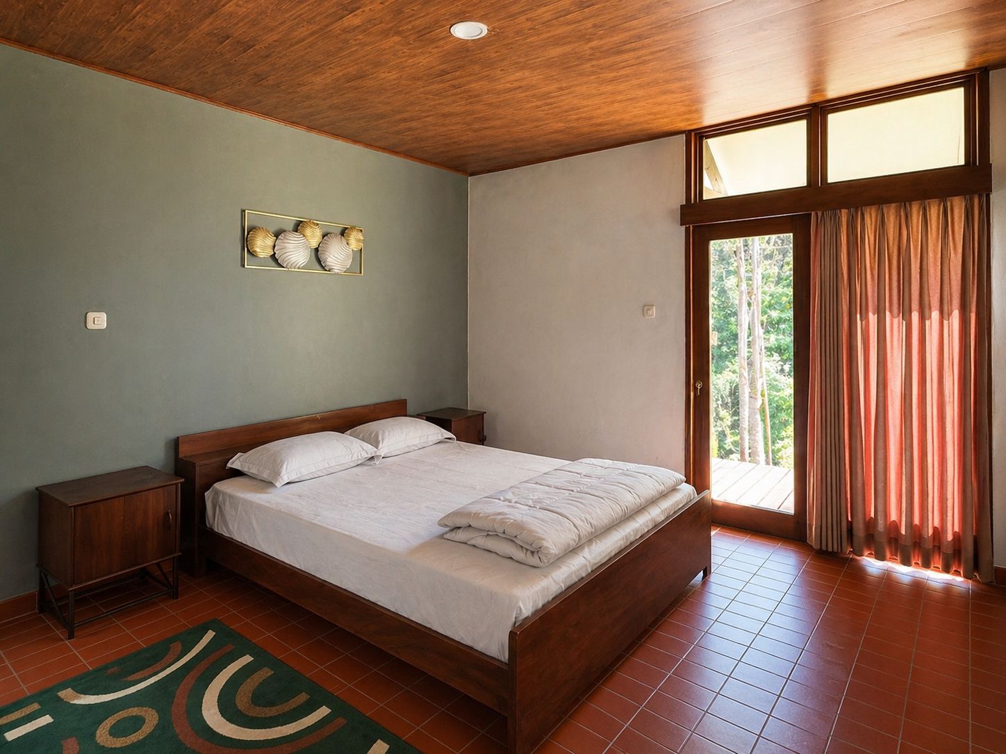 Bedroom with bed, side table, curtains, and balcony door