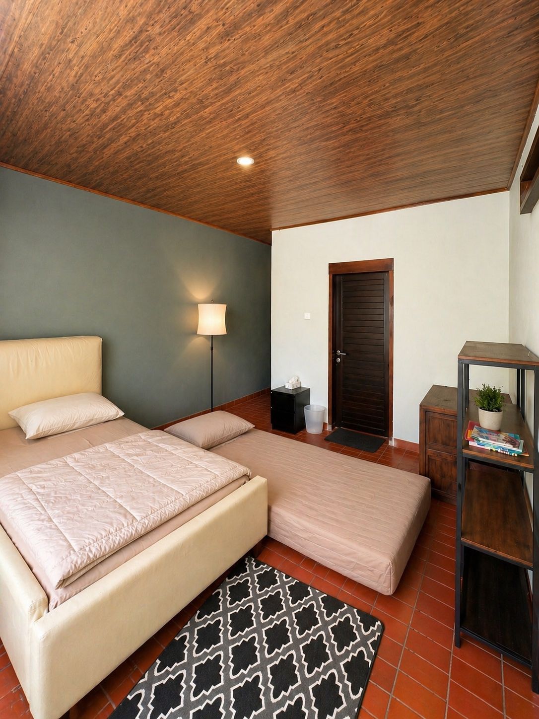 Bedroom with double bed and warm wood finishes